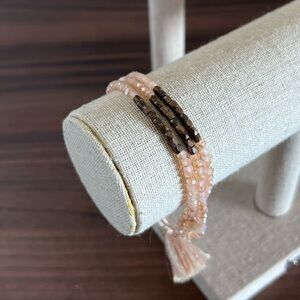 Triple strand pink/bronze faceted bead adjustable bracelet